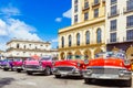 American red 1955, 1956 convertible, pink 1957 convertible and a 1958 convertible vintage car Royalty Free Stock Photo