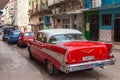 Red, classic, old American car on the street in Havana Royalty Free Stock Photo