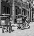 HAVANA, CUBA-OCTOBER 29- Men peddle bike taxis through the streets of Havana, Oct 29, 2015-