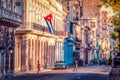 HDR - Street life view with cuban flags, american blue white 1953 Chevrolet Bela air and Buick Special Royalty Free Stock Photo