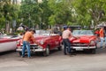 Taxi drivers cleaning, old American cars in Havana Royalty Free Stock Photo