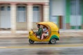 HAVANA, CUBA - OCTOBER 21, 2017: Yellow Tuk Tuk Vehicle as a Taxi in Havana, Cuba Royalty Free Stock Photo