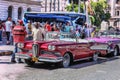 Havana / Cuba - 07/2018: Old and rusty vintage american cars of 1950s taxi in Havana. Red Edsel Pacer on the front position, the