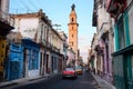 Havana, Cuba - 03/28/2018: The red retrocar goes through the quarter of Havana Royalty Free Stock Photo