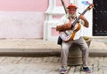 Cuban street musician plays on his guitar for money in Havana City Cuba - Serie Cuba Reportage