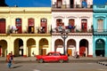 Street scene with classic car and colorful buildings in Old Havana Royalty Free Stock Photo