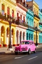 Classic car and colorful buildings at sunset in Old Havana Royalty Free Stock Photo