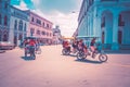 Havana / Cuba - 04.15.2015: Three typical Cuban bike taxis aka bicitaxi biking on the streets of Havana, Cuba