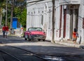 HAVANA - OCTOBER 26-Local street scene of people, old cars and colonial architecture in, Havana, Cuba on October 26, 2015