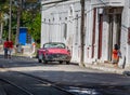 HAVANA - OCTOBER 26- Local street scene of people, old cars and colonial architecture in, Havana, Cuba on October 26, 2015