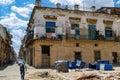 Cuba, Havana street with old destroyed houses and garbage cans