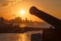 Havana at sunset with the silhouette of an old cannon on the foreground Royalty Free Stock Photo