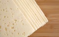 Havarti cheese slices on a cutting board Royalty Free Stock Photo