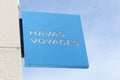Havas Voyages logo on a wall