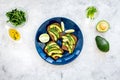 Have a bite with healthy snacks. Avocado toast on grey background top view Royalty Free Stock Photo