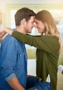 They only have eyes for each other. an affectionate young couple hugging in their kitchen. Royalty Free Stock Photo