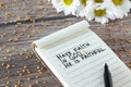 Have faith in God, He is Faithful. Inspiring Christian bible quote handwritten in notebook with mustard seed and flowers on wood