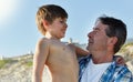 They always have a fantastic family holiday at the beach. a father and son bonding together at the beach. Royalty Free Stock Photo