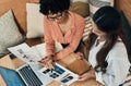 We have a few designs in mind. two businesswomen having a discussion in a cafe. Royalty Free Stock Photo