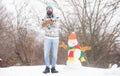 Have fun frosty winter day. Let it snow. Christmas holidays. Active lifestyle. Man bearded hipster cute knitted hat play Royalty Free Stock Photo