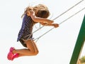 Girl swinging on swing-set. Royalty Free Stock Photo