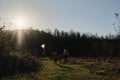 Have fun spending time with two children outdoors in nature. Joy of parenthood. Father and mother run with their daughter and son Royalty Free Stock Photo