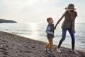 We have fun wherever we go. a young woman and her son enjoying a walk by the water. Royalty Free Stock Photo