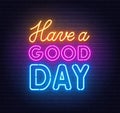 Have a Good Day neon lettering on brick wall background.