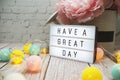 Have a Great Day text on lightbox on wooden background Royalty Free Stock Photo