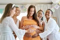 They have the hiccups. a group of friends celebrating at a baby shower. Royalty Free Stock Photo