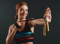 Have I ever skipped a workout Never. Studio portrait of a sporty young woman posing with a skipping rope against a black Royalty Free Stock Photo