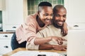 Have a look at that. a happy young couple using a laptop while relaxing together at home. Royalty Free Stock Photo