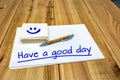 Have a nice day, the inscription on the sheets of white paper Royalty Free Stock Photo