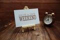 Have a nice weekend text on paper card on wooden background Royalty Free Stock Photo