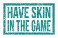 HAVE SKIN IN THE GAME, words on blue rectangle stamp sign