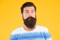 Have some doubts. Hipster bearded face not sure. Doubtful bearded man on yellow background close up. Doubtful expression