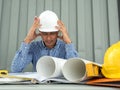 Have stress, Asia Engineer serious thinking, young man and looking away while sitting Royalty Free Stock Photo
