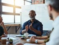 We have to stick to what we know. a group of business colleagues in the office having a meeting and discussing plans for