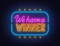 We Have a Winner Neon Sign on brick wall background. Royalty Free Stock Photo