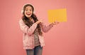 have you seen that. child pointing finger on paper for copy space. online education announcement. advertising technology