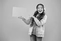 have you seen that. child pointing finger on paper for copy space. online education announcement. advertising technology