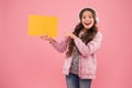 Have you seen that. child pointing finger on paper for copy space. online education announcement. advertising technology