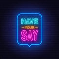 Have Your Say neon sign in the speech bubble on brick wall background.