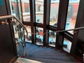 The Haven circular staircase going between floors on the Norwegian Escape cruise ship