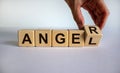 Having anger or being an angel. Hand turns a cube and changes the word `anger` to `angel`. Beautiful white background. Busines Royalty Free Stock Photo