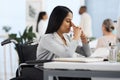 Having a bit of a bad day. an attractive young businesswoman looking stressed while working at her desk in the office. Royalty Free Stock Photo