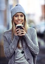 Having coffee in the city. Portrait of a beautful young woman drinking coffee while out in the city.