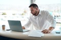 Having the correct paperwork matters. a young car salesman filling out paperwork in his office. Royalty Free Stock Photo
