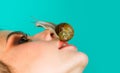 Having fun with adorable snail. Cosmetics and snail mucus. Girl fashionable makeup face and cute snail. Cosmetology Royalty Free Stock Photo
