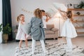 Having fun at birthday party. Group of children is together at home at daytime Royalty Free Stock Photo